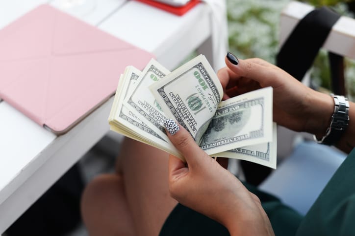 Businesswoman counting money.