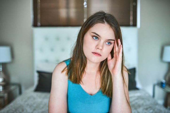 upset young woman at home