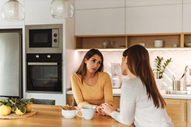 two friends having serious conversation
