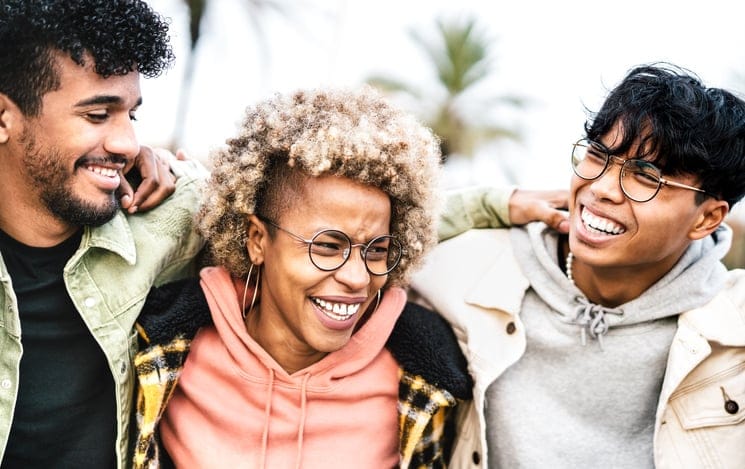 Group of teen friends laughing.