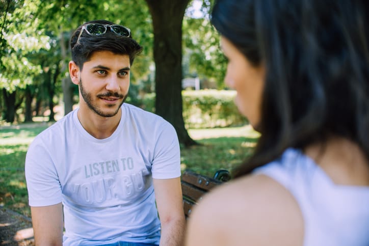 man looking skeptical at woman