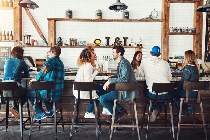 couple enjoying drink at bar