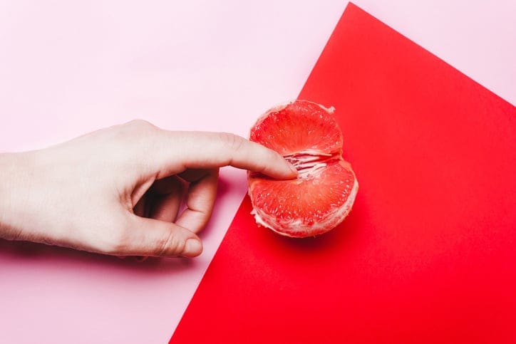 masturbation concept finger on grapefruit