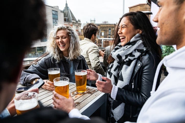friends drinking at outdoor brewery