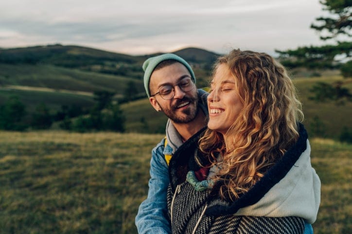 couple hanging out outdoors on an autumn day