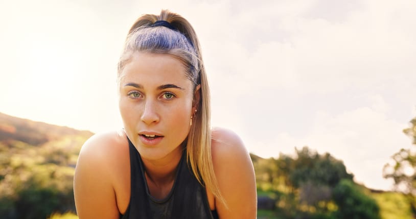 woman catching breath after run