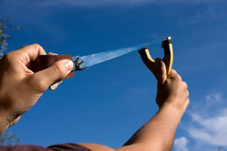 slinghsot pointed at sky
