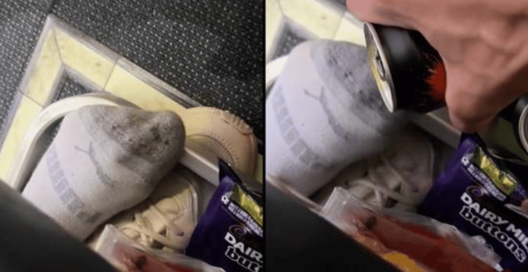 man pours drink on women's feet on plane
