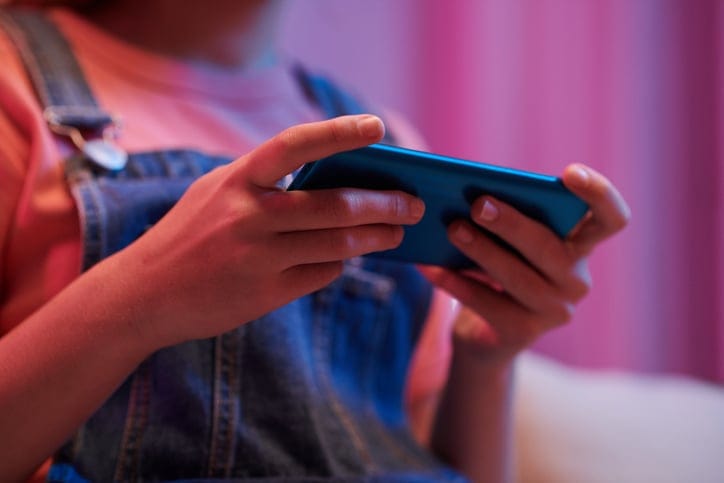 Teen girl on her smartphone.
