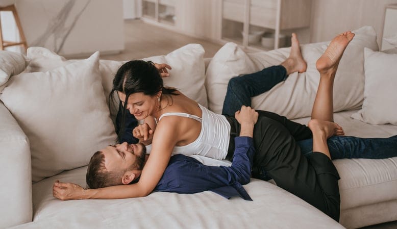 couple kissing on the couch