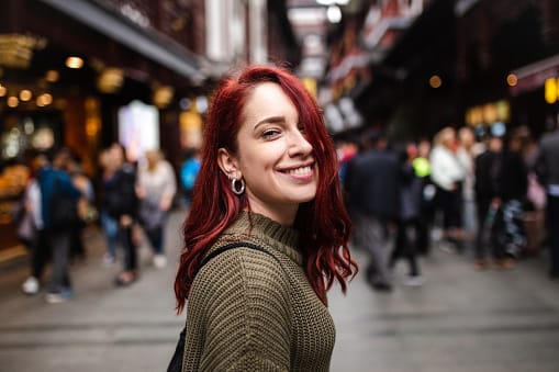woman smiling looking over shoulder