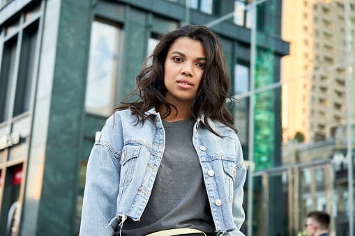 serious woman on city street