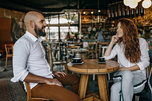 couple having serious convo in bar