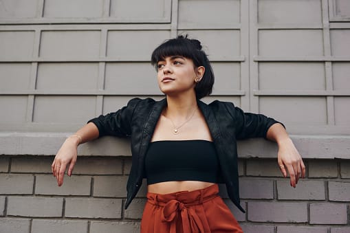 stylish young woman looking to side