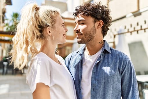 couple about to kiss in sunshine