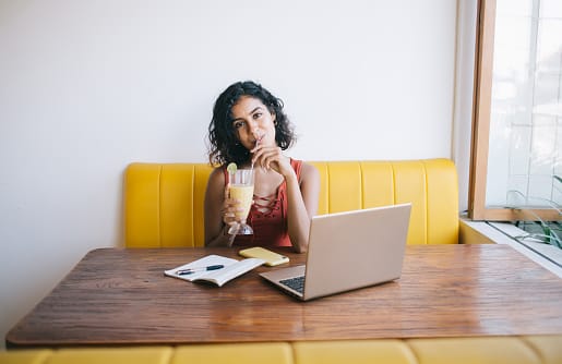 Woman sitting at her desk with her calendar.