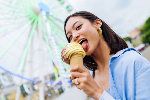 Woman eating ice cream.