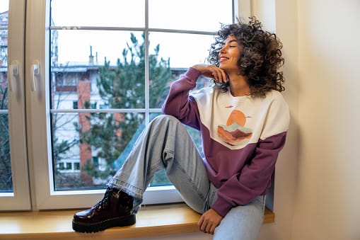 happy woman looking out window