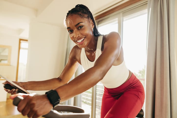 woman working out on spin bike