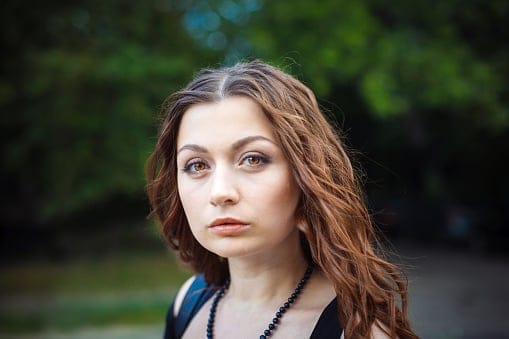 Portrait of a beautiful young woman. Focus on the eye.