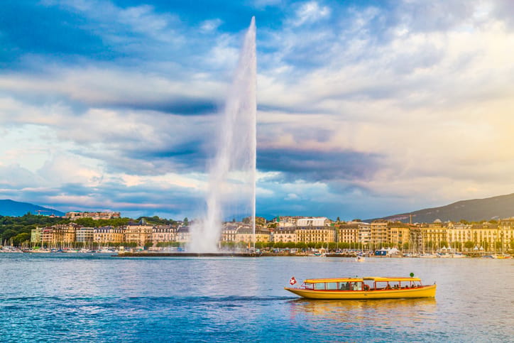 City of Geneva with Jet d'Eau fountain at sunset, Switzerland.