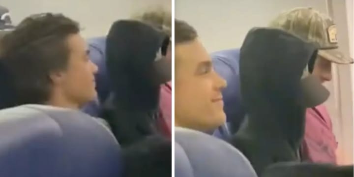 man sitting next to blow-up doll plane