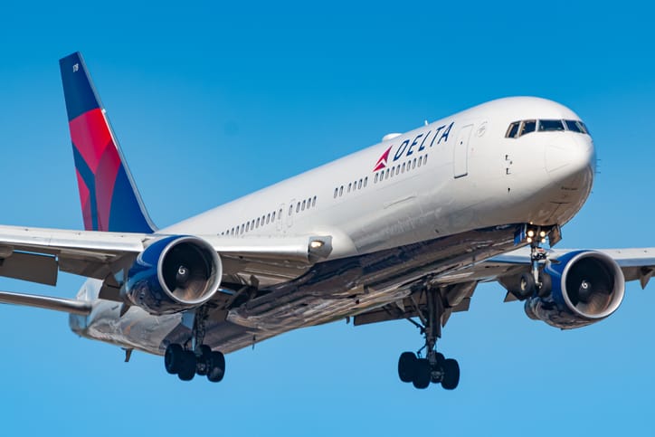 A Delta airplane in the air.