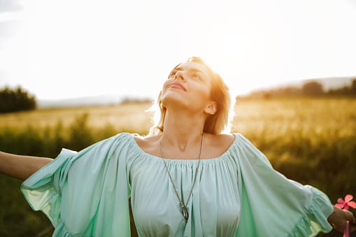 Woman making time for healing beauty of nature.