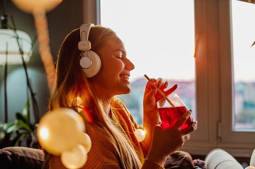 Young woman listening with headphones.