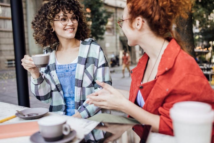 two women enjoying coffee
