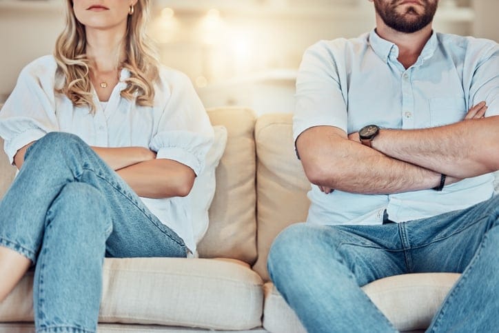 angry couple sitting on couch