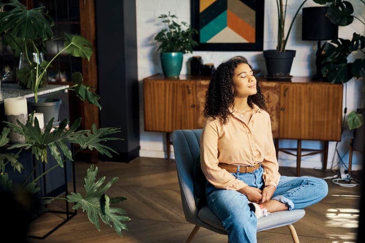 zen woman closed eyes chair