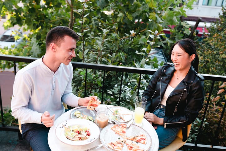 laughing couple on restaurant date