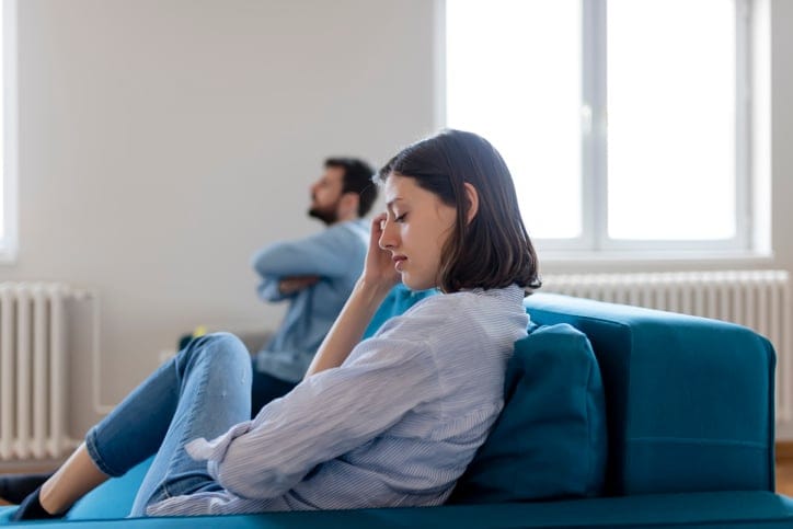 woman frustrated with boyfriend throwing fit