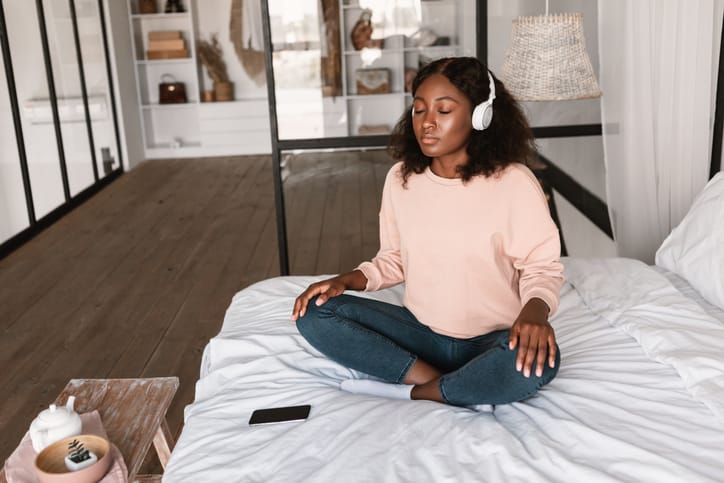 Woman listening and concentrating with headphones.