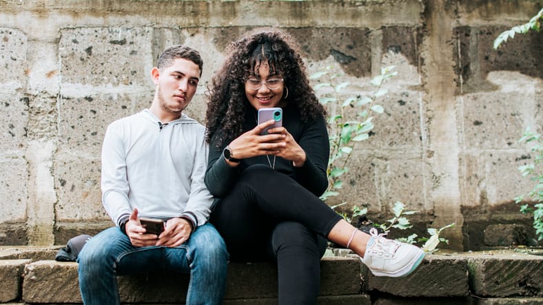 man looking at women's texts