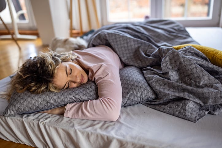 woman sleeping in bed peacefully