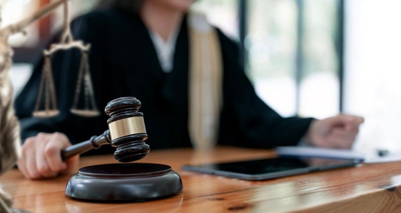 female judge banging gavel
