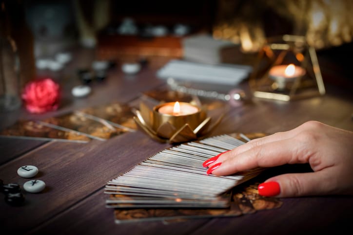 Fortune teller reading tarot cards.