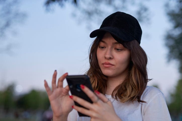 annoyed woman texting
