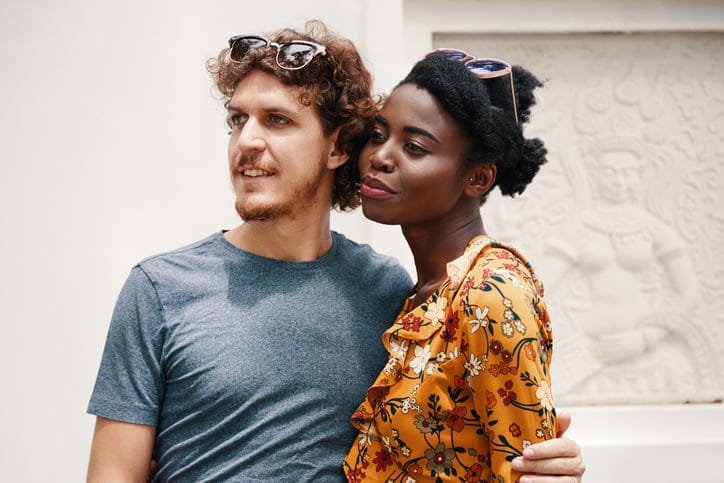 couple posing on sunny day