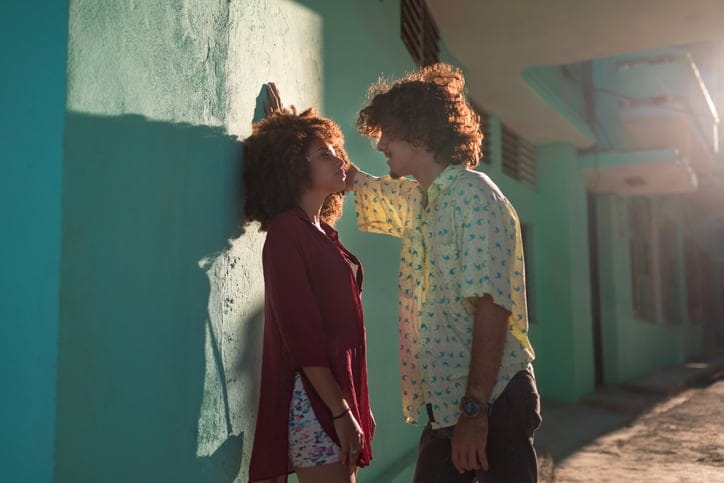 Latin American couple in the city looking each other
