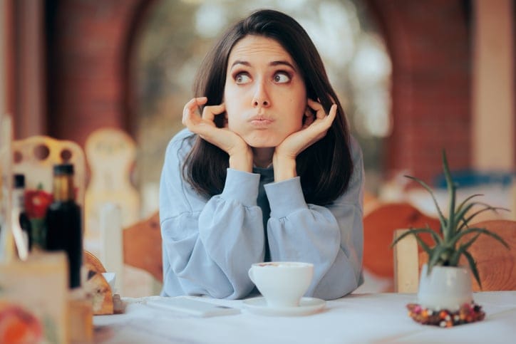 Unhappy cafeteria customer complaining about the environmental noise