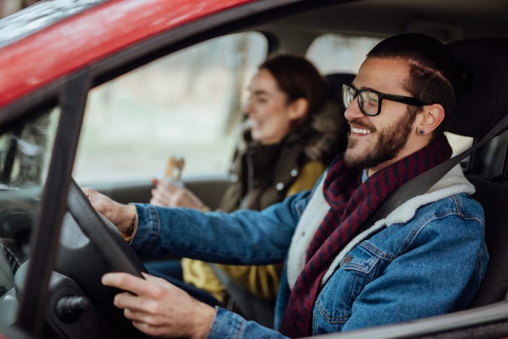 couple driving on road trip