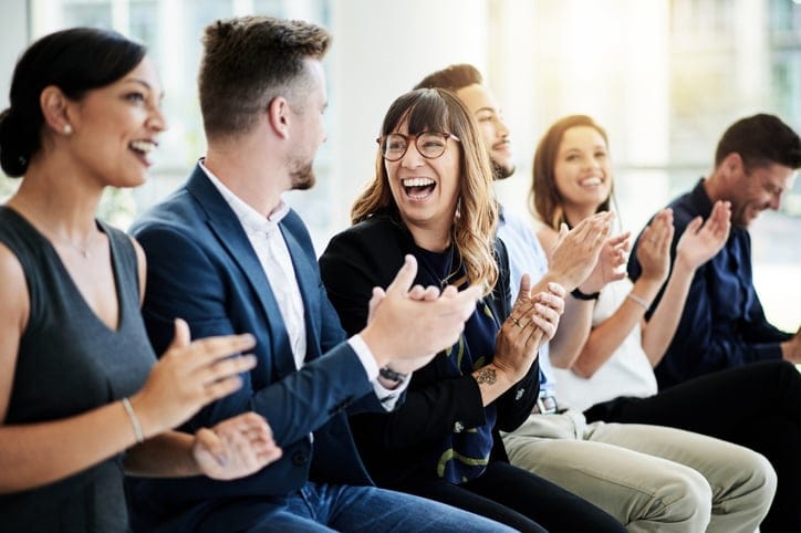 Shot of a group of businesspeople applauding during a seminar