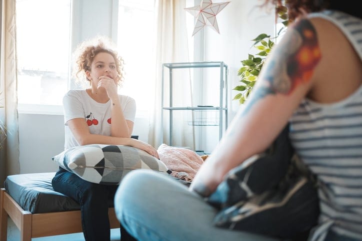 frustrated woman talking to friend