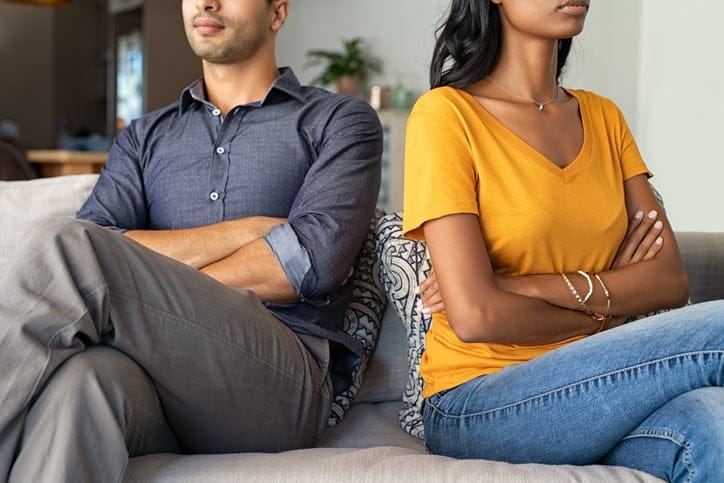 stubborn couple with arms crossed
