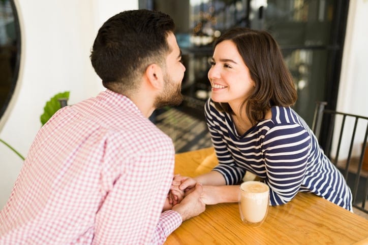 Gorgeous man and woman staring into each other's eyes