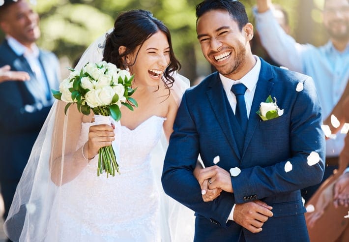 Newlyweds are greeted with festive confetti.