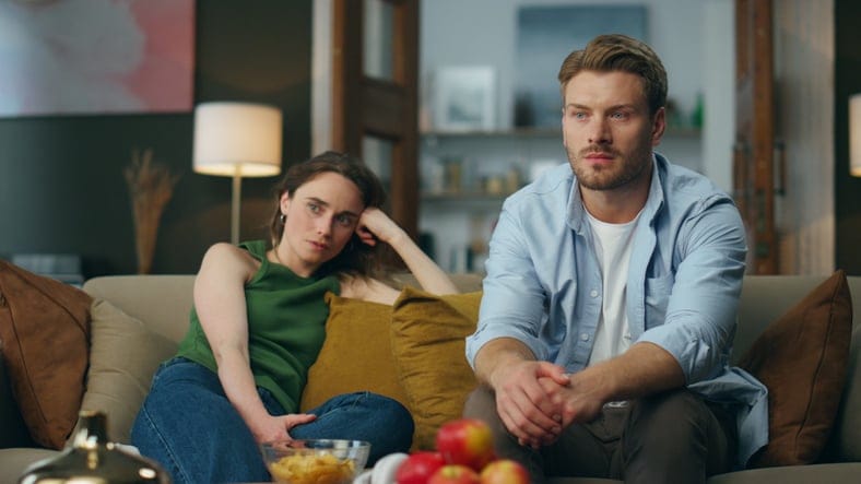 Involved couple watching a movie.